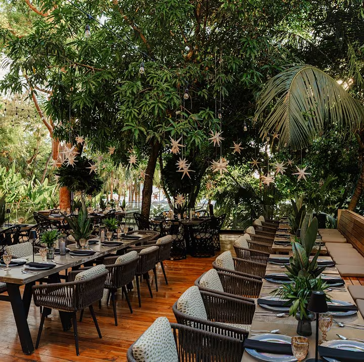 Alera · garden dining on West Bay Beach
